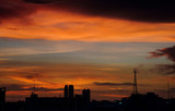 Fototapeta Nowy Jork - Rainbow color of twilight sky cloud in a evening over Bangkok city, Thailand