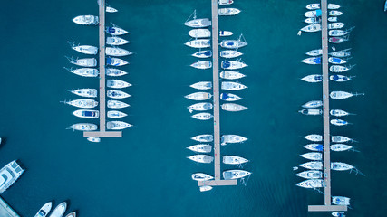 Aerial view of yachts and boat berthed in the marina and clear water. Aerial view of the Marina in Turkey. Holiday icons .