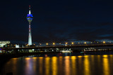 Fototapeta  - View of the center of Dusseldorf, river Rhine and the TV tower in night, Germany