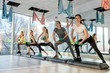 © RomanR - Healthy, young group of women doing exercises in gym