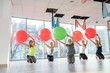 © RomanR - Group of women in gym making exercises on ball
