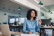 © mavoimages - Young businesswoman writing ideas in a notebook at her desk