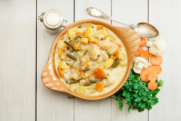 Wall Mural - Vegetable soup with ingredients carrot, cauliflower, potato and