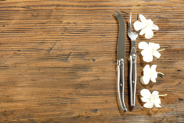 Fresh flowers and kitchen desk with fork 