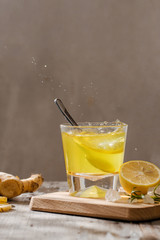 Wall Mural - refreshing citrus lemonade,summer drink. Lemonade with fresh lemon on wooden background