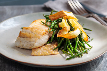 Wall Mural - Sea bass fillet with parsnip crisp and samphire 