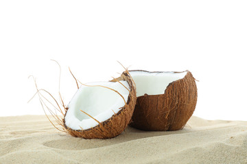 Coconuts on clear sea sand isolated on white background. Summer vacation