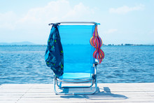 Bikini And Swimming Trunks Drying On A Pier
