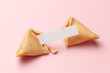 Chinese fortune cookies. Cookies with empty blank inside for prediction words. Pink background.