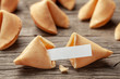 Chinese fortune cookies. Cookies with empty blank inside for prediction words. Background of old wooden table.