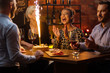 © Nejron Photo - Group of friends celebrating birthday in a cafe behind bar counter