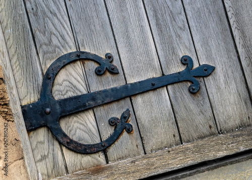 Close Up Detail Of A Very Old Decorative Strap Hinge On A Building