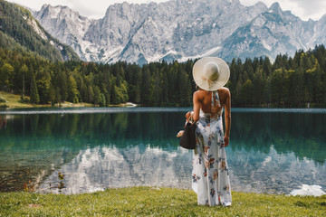 Sticker - Young beautiful woman in a dress and hat near the lake