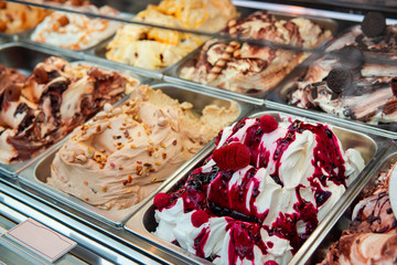 Ice cream in Rome, Italy. Italian gelateria. Ice-cream cafe, show window with sweeties.