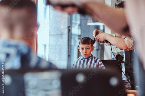 Little Pretty School Boy Had His First Trendy Haircut At Modern