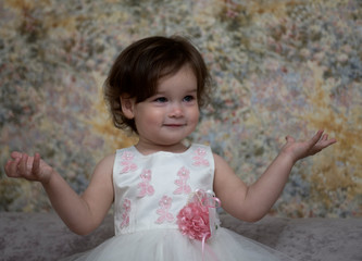 Portrait of a beautiful little girl in the room