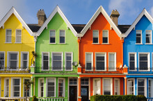 Row Of Brightly Painted Multicoloured Houses In Whitehead, Northern Ireland