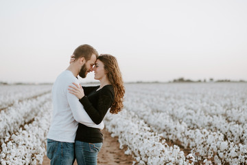 happy couple in a cotton field