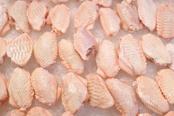 frozen chicken wings on the ice for sale