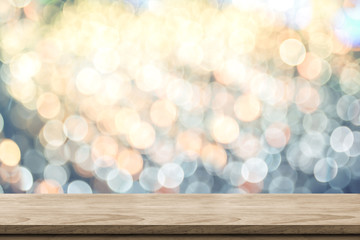 Poster - Empty brown wood table top with blur sparkling soft pastel blue and orange bokeh abstract background,panoramic banner for display or montage of product,Holiday seasonal concept backdrop