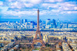 Paris cityscape. Aerial view of the main attractions of Paris Eiffel Tower on background of business district of La Defense, seen from Montparnasse skyscraper, France.