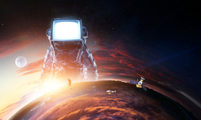 Wall Mural - astronaut with tv head in space. mixed media.