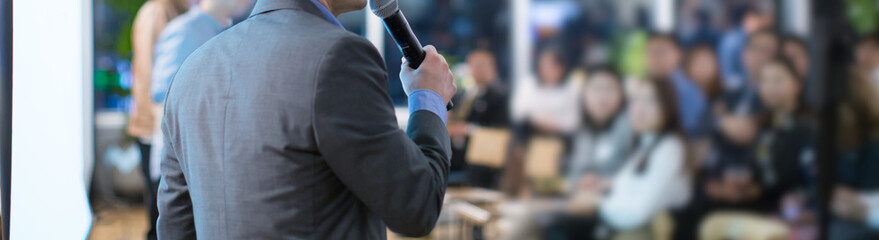 Fototapete - Conference with panel speakers on stage during debate. Presenters at corporate seminar talking to audience.  Business leadership CEO lecture during convention. Executive board of directors.