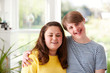 Portrait Of Loving Young Downs Syndrome Couple At Home Together