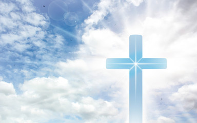 Wall Mural - Crucifix cross on beautiful sky with sunbeam. Holy cross of Jesus christ on clouds background.
