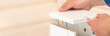 © Ахтем - The buyer collects ready-to-assemble folding table. Ready-to-assemble furniture