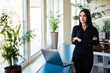 © F8  \ Suport Ukraine - Portrait of successful young businesswoman standing at her office.