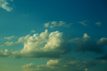 Large heavy clouds slowly float across the blue beautiful sky. Stunning landscape and view. Blue sky with cloud