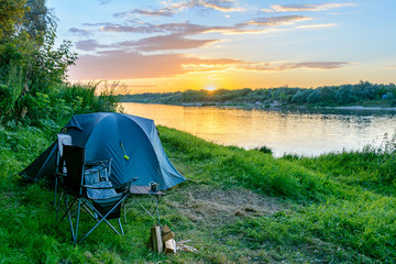 Wall Mural - camping tent in a camping in forest by the river