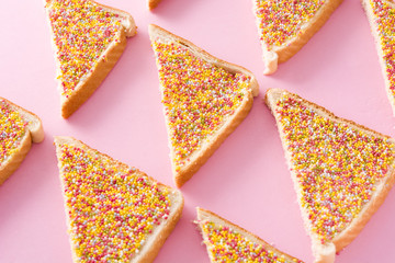 Traditional Australian fairy bread pattern on pink background