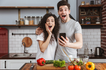 Sticker - Cheerful couple cooking healthy fresh salad