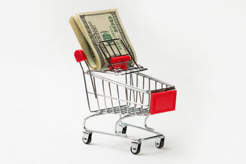 Grocery cart with Bitcoin wheels. The concept of technological breakthrough, online shopping.	