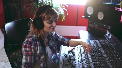 Sticker - Sound producer working at recording studio using soundboard and monitors