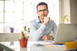 © merla - Handsome businessman sitting in his office