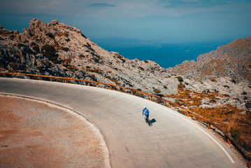 Wall Mural - Man ride on bicycle in Famous Sa Calobra Climb in Mallorca. Original sport wallpaper