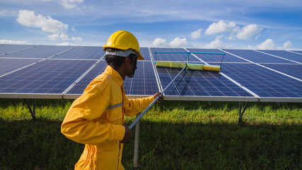 operation and maintenance in solar power plant ; engineering team working on checking and maintenance in solar power plant ,solar power plant to innovation of green energy for life