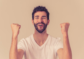 Portrait of surprised and happy man celebrating victory goal or winning lottery in human emotions