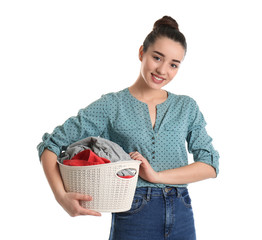 Canvas Print - Happy young woman holding basket with laundry on white background