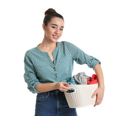 Poster - Happy young woman holding basket with laundry on white background