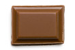 © Moving Moment - Single square of milk chocolate isolated on white from above.