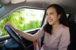 © comzeal - Asian women driving a car and smile happily with glad positive expression during the drive to travel journey, People enjoy laughing transport and relaxed happy woman on roadtrip vacation concept