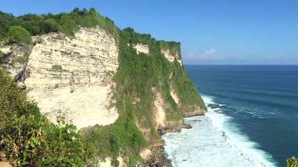 Wall Mural - Scenic view over the cliffs from the Ulu Watu Temple on Bali. Indonesia, 4k footage video