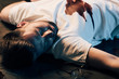 © LIGHTFIELD STUDIOS - dead man with blood on t-shirt on floor at crime scene