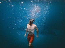 Man Snorkeling Under Body Of Water