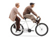 Senior man and woman riding a tandem bicycle with legs up