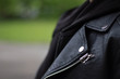 Female leather jacket, Detail close-up of suit jacket lapel button hole fabric